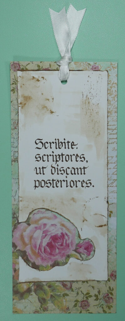 book mark with text "scribite, scriptores, ut discant posteriores"